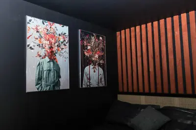 three pictures on the wall of a room at One of Kind Boutique Pad in Liverpool