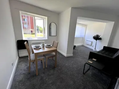 a living room with a table and a couch at Marina Princes Reach 2 in Penwortham