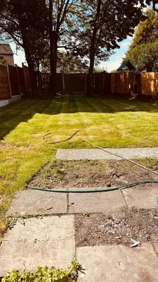 a yard with a hose on the grass at Entire Immaculate 3 Bedrooms House in Blackburn Weekend Away in Blackburn