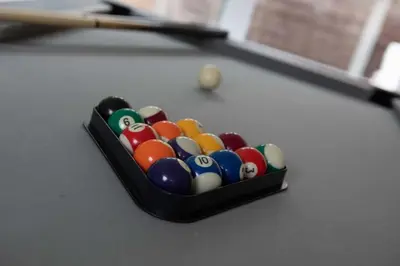 a tray of billiard balls sitting on top of a table at Woodland House - in Walton le Dale