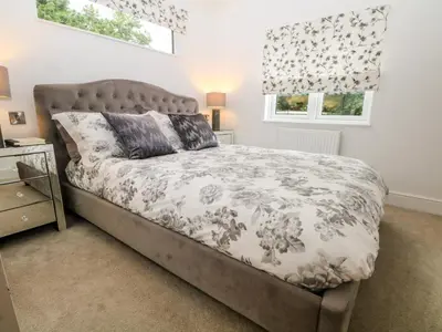 a bedroom with a bed and a window at Ruperts Retreat in Preston