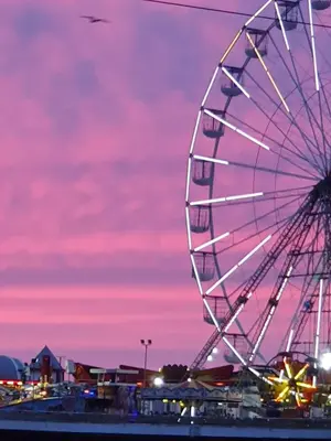 a ferris wheel at a carnival at sunset at Tobermory Hotel in Blackpool