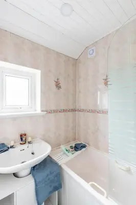 a bathroom with a sink and a toilet and a tub at Lookout 5-Bed House in Darwen Blackburn BB1 Free Parking Roadside in Rishton