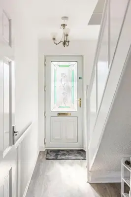 a white hallway with a white door with a window at Lookout 5-Bed House in Darwen Blackburn BB1 Free Parking Roadside in Rishton