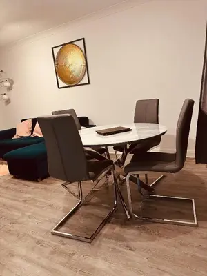 a dining room with a table and chairs at Lookout 5-Bed House in Darwen Blackburn BB1 Free Parking Roadside in Rishton