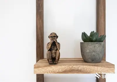 a wooden owl figurine sitting on a shelf next to a plant at One Bedroom Apartment At Smooth Stays Short Lets & Serviced Accommodation Preston With Parking Near Train Station in Preston