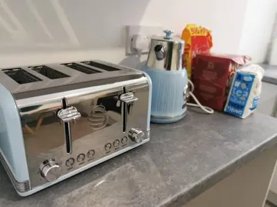 a toaster oven sitting on top of a kitchen counter at 'The Love Nest' Apartment Liverpool, Netflix in Liverpool