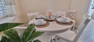 a white dining room table with white dishes on it at Toffees Townhouse a 2 Bed House in Liverpool 1 Mins walk to Goodison Park in Liverpool