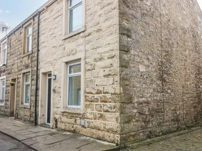 an old brick building on the side of a street at 2 Brook Street in Clitheroe