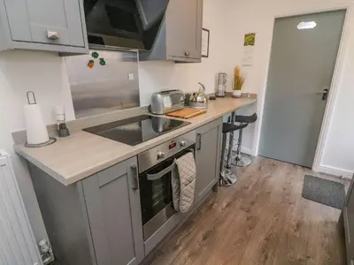 a kitchen with a sink and a counter top at 2 Brook Street in Clitheroe