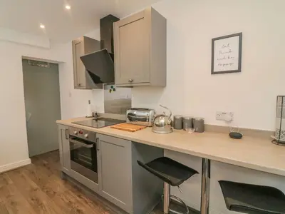 a kitchen with a sink and a counter top at 2 Brook Street in Clitheroe