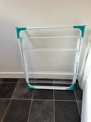 a metal towel rack in a room with a tile floor at Blackpool Rocks Pleasure Beach in Blackpool