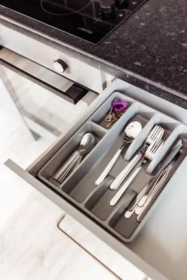 a drawer in a kitchen with silver utensils at Brown Ball in Barrow in Furness