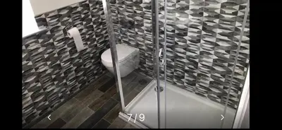 a bathroom with a toilet and a shower at Apartments on Albert Road with free parking in Blackpool