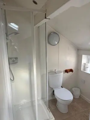 a bathroom with a toilet and a shower at Bronte House - Blackpool in Blackpool