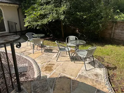 a group of chairs and tables on a patio at Fulwood House in Grimsargh