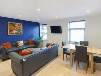 a living room with a couch and a table at No10 Apartments in Blackpool