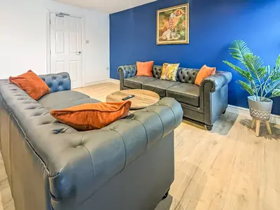 a living room with a couch and a table at No10 Apartments in Blackpool