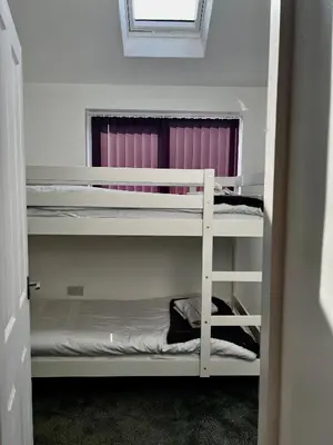 a room with two bunk beds and a window at The Annexe, St Andrews house hotel, Two bedrooms Sleeps 4 in Preston