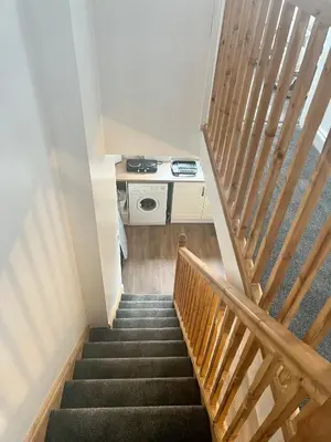 a staircase leading up to a room with a desk at The Annexe, St Andrews house hotel, Two bedrooms Sleeps 4 in Preston