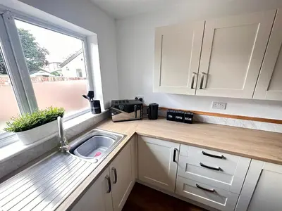 a kitchen counter with a sink and a window at The Annexe, St Andrews house hotel, Two bedrooms Sleeps 4 in Preston