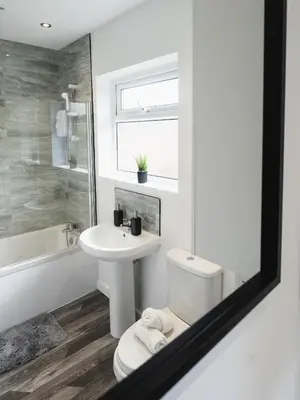a bathroom with a toilet and a sink at Comfy Spacious Home Near Preston City Centre - Sleeps 6 in Samlesbury