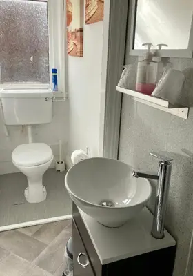 a bathroom with a sink and a toilet at The Hotel And Bar Blackpool in Blackpool
