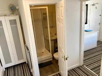 a bathroom with a shower and a toilet and a sink at The Hotel And Bar Blackpool in Blackpool