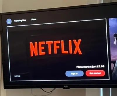 a television with the words netflix on the screen at Townsend lane accommodation in Liverpool