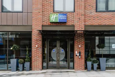 a entrance to a brick building with a revolving door at Holiday Inn Express Liverpool - Central by IHG in Liverpool