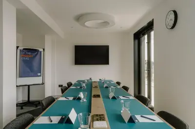 a conference room with a long table and chairs at Holiday Inn Express Liverpool - Central by IHG in Liverpool
