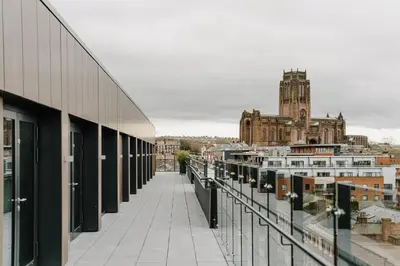 a view of a city from the balcony of a building at Holiday Inn Express Liverpool - Central by IHG in Liverpool