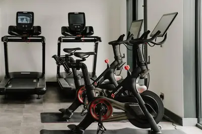 a gym with three exercise bikes in a room at The Halyard Liverpool, Vignette Collection by IHG in Liverpool