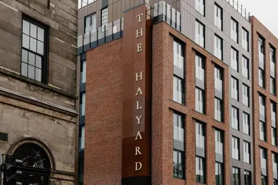 a sign on the side of a brick building at The Halyard Liverpool, Vignette Collection by IHG in Liverpool