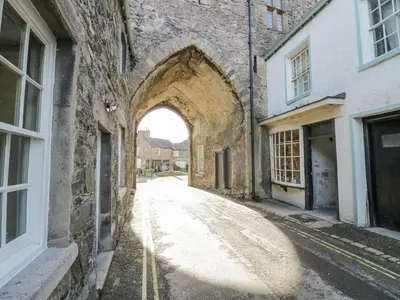 an alley with an archway in an old building at Egg Pudding Stone in Grange Over Sands