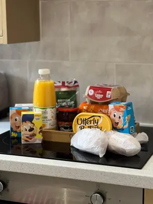a counter with food and other food items on it at Emerald Apartment Pleasure Beach Blackpool in Blackpool