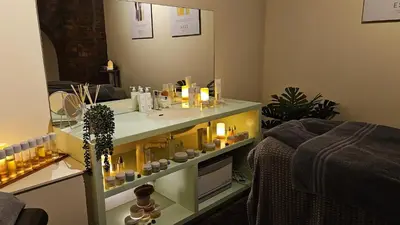 a bathroom with a vanity with candles and a mirror at Titanic Hotel Liverpool in Liverpool