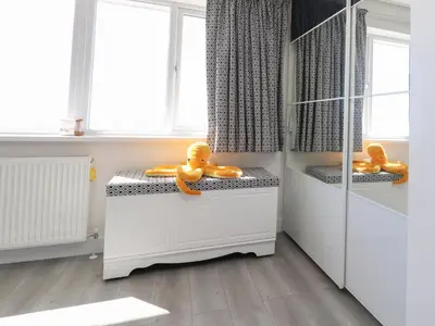 a bathroom with two rubbericans sitting on a counter at 26 North Promenade in Cleveleys