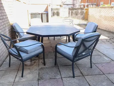 a table and four chairs sitting around a table and chairs at 26 North Promenade in Cleveleys