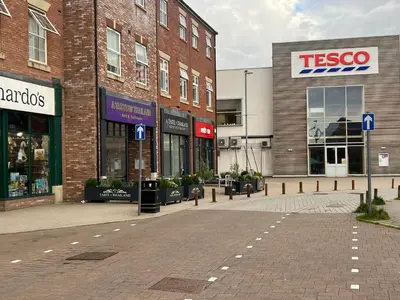 an empty street in front of a store at Buckshaw Snoozy in Heapey