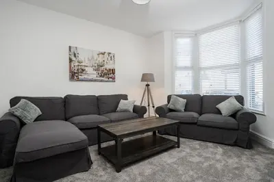 a living room with a couch and a coffee table at DACY LODGE, Anfield - Strictly NO Parties in Liverpool