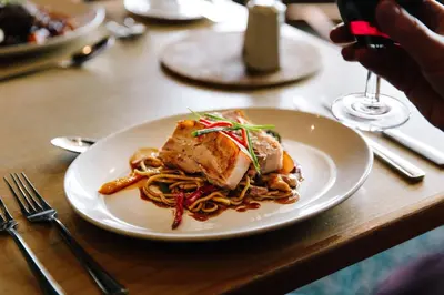 a plate of food with noodles on a table at Claremont Hotel - All Inclusive! in Blackpool