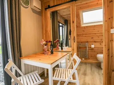a dining room with a table and two chairs at Forest in Dalton in Furness