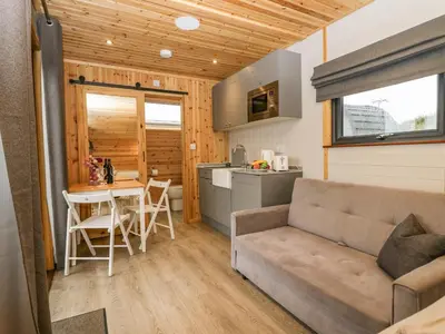 a living room with a couch and a table at Forest in Dalton in Furness
