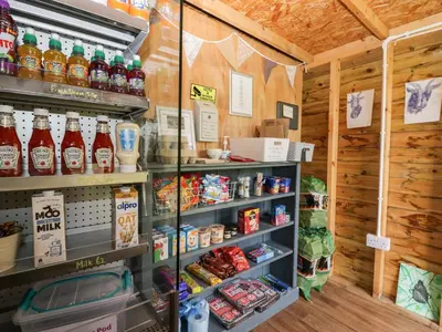 a store filled with lots of drinks and food at Forest in Dalton in Furness