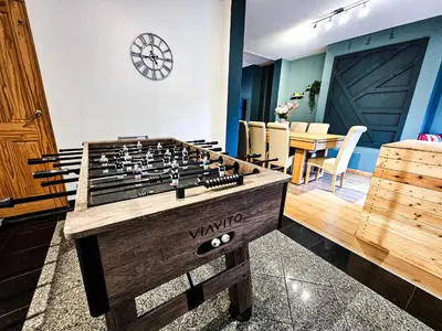 a room with a large wooden chess board at Luxe Retreat - Steps from Stadium - Pool Table, Ping Pong, Football Table in Liverpool