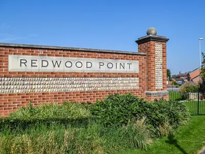 a redwood point sign on a brick building at The Goldsmith in Blackpool