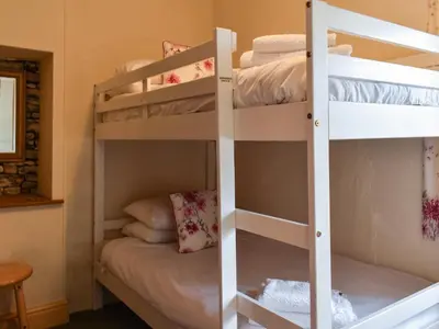 a bunk bed room with two bunk beds at Byways in Cartmel