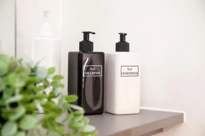 two bottles ofodorizers are sitting on a shelf at Modern 1-Bedroom Liverpool Apartment, Cosy & Fast Wi-Fi in Liverpool