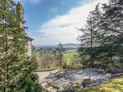 an aerial view of a house with trees at Mulberry Beautiful Apartment with Sea View - Pass the Keys in Grange Over Sands